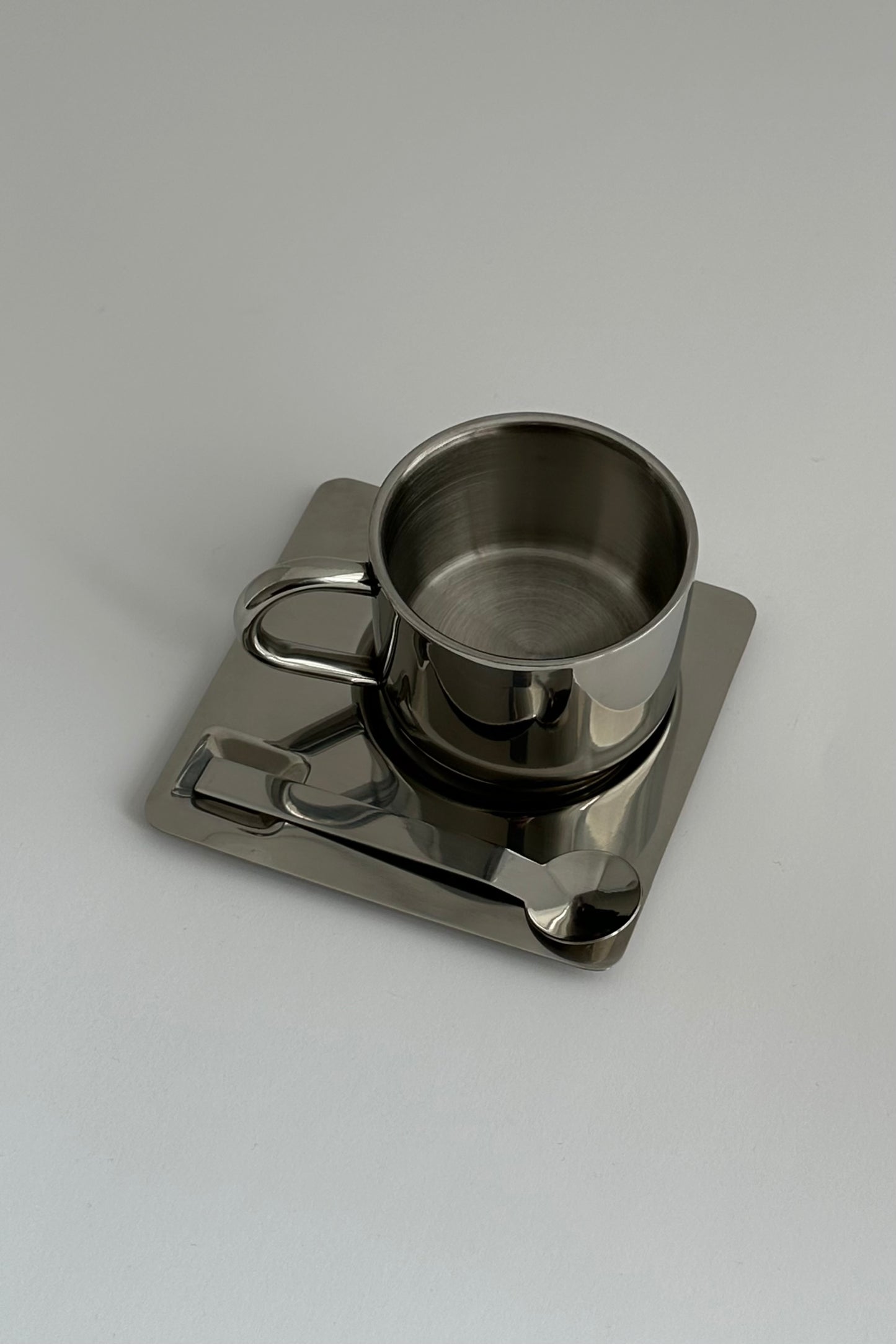 HEDONISM stainless steel cup with saucer