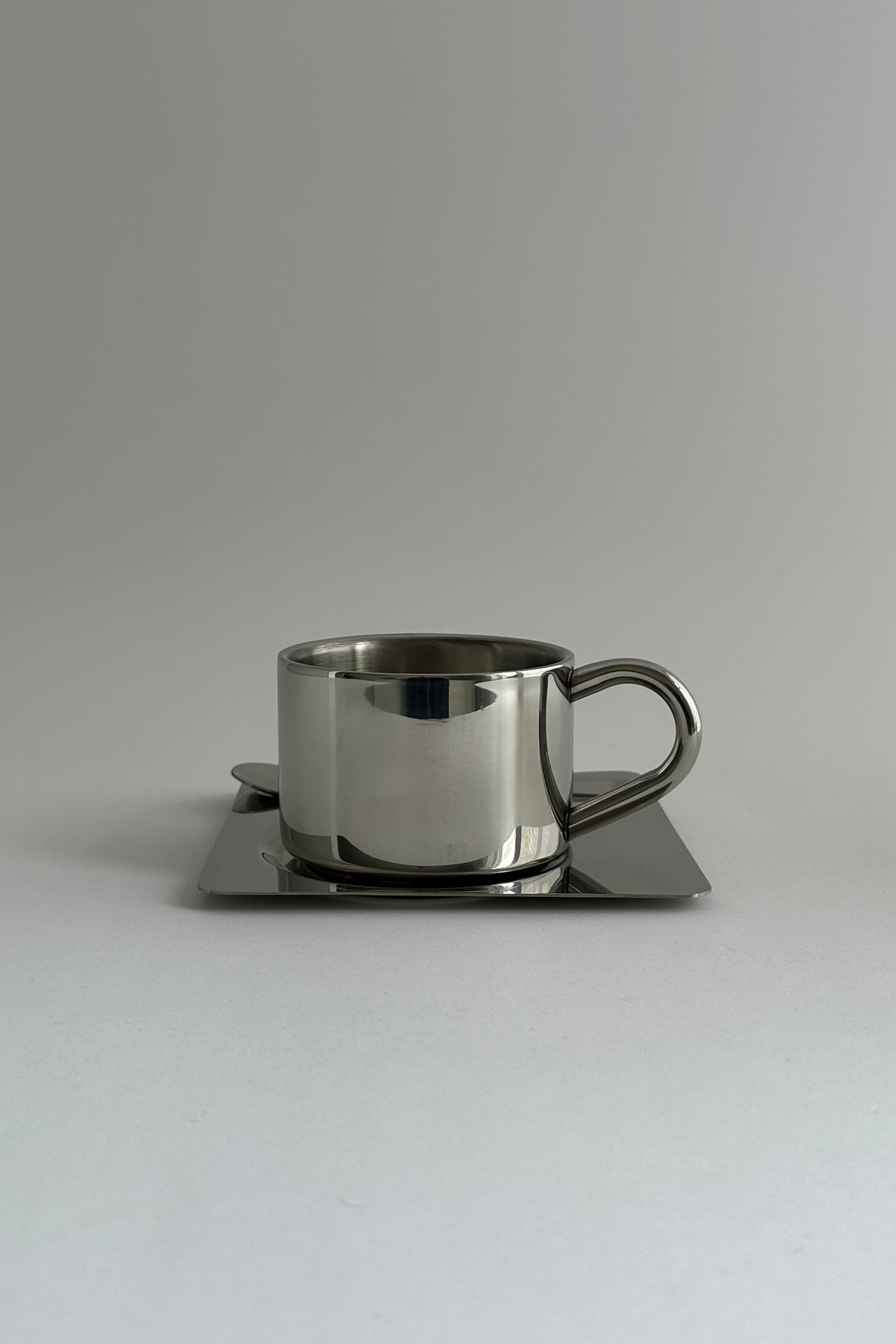 HEDONISM stainless steel cup with saucer